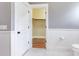 White bathroom with built-in closet and hexagon tile floor at 153 Ashby Cove Ln, New Smyrna Beach, FL 32168