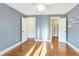 Bright bedroom with hardwood floors and ample closet space at 153 Ashby Cove Ln, New Smyrna Beach, FL 32168