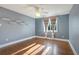 Bedroom with hardwood floors, light blue walls, and window at 153 Ashby Cove Ln, New Smyrna Beach, FL 32168