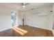 Well-lit bedroom with hardwood floors and en-suite bathroom at 153 Ashby Cove Ln, New Smyrna Beach, FL 32168