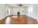 Bright living room featuring hardwood floors and a fireplace at 153 Ashby Cove Ln, New Smyrna Beach, FL 32168