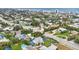 High-angle view of a home near the beach and city, highlighting solar panels and landscaping at 1916 S Peninsula Dr, Daytona Beach, FL 32118