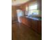 Kitchen with wood cabinets, and a double sink at 2017 Royal Palm Dr, Edgewater, FL 32141