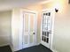 Bedroom with French doors and built-in closet at 205 Mary Ave, New Smyrna Beach, FL 32168