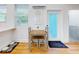 Small dining area with table and chairs near kitchen at 205 Mary Ave, New Smyrna Beach, FL 32168