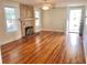 Living room with hardwood floors and fireplace at 205 Mary Ave, New Smyrna Beach, FL 32168