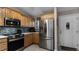 Kitchen with stainless steel appliances and light wood cabinets at 2259 Hawks Cove Cir, New Smyrna Beach, FL 32168