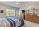 Serene bedroom with king bed, dresser and TV at 270 Eagle Harbor Way, Daytona Beach, FL 32124