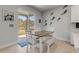 Bright breakfast nook with wood table and built in bench seating near sliding doors at 270 Eagle Harbor Way, Daytona Beach, FL 32124