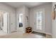 Neutral-toned entryway with tile floor, stained glass door and a sitting bench at 270 Eagle Harbor Way, Daytona Beach, FL 32124