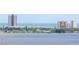Aerial view of waterfront property with high-rise buildings in background at 2801 S Ridgewood Ave # 1215, South Daytona, FL 32119
