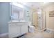 Bright bathroom with a walk-in shower and updated vanity at 2801 S Ridgewood Ave # 1215, South Daytona, FL 32119