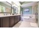 Elegant bathroom with double vanity and soaking tub at 2801 S Ridgewood Ave # 1215, South Daytona, FL 32119