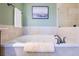 Relaxing bathroom with soaking tub and shower at 2801 S Ridgewood Ave # 1215, South Daytona, FL 32119