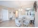 Open concept dining area with kitchen views, seating for four at 2801 S Ridgewood Ave # 1215, South Daytona, FL 32119