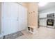 Bright entryway with view into kitchen and bench at 2801 S Ridgewood Ave # 1215, South Daytona, FL 32119