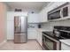 Modern kitchen with stainless steel appliances and white cabinets at 2801 S Ridgewood Ave # 1215, South Daytona, FL 32119