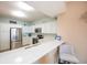 Modern kitchen with stainless steel appliances and white cabinets at 2801 S Ridgewood Ave # 1215, South Daytona, FL 32119