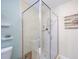 Large walk-in shower with tiled walls and a glass door at 2801 S Ridgewood Ave # 1215, South Daytona, FL 32119