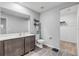 Modern bathroom with gray vanity, white countertop, and walk-in closet at 2859 Bluffview Cir, Deltona, FL 32738