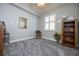 Well-lit bedroom with a chair, bookcase, and window seat at 2901 S Atlantic Ave # 603, Daytona Beach, FL 32118