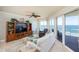 Living room with ocean view, comfy seating, and large TV at 2901 S Atlantic Ave # 603, Daytona Beach, FL 32118