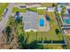 Aerial view showing the house, pool, and surrounding neighborhood at 2919 Pine Tree Dr, Edgewater, FL 32141