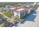 Aerial view of beachfront community showcasing building and beach access at 3001 S Atlantic Ave # 404, New Smyrna Beach, FL 32169