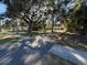 A view of the front yard from the street with trees and a camper at 3258 S Ridgewood Ave, Edgewater, FL 32141