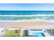 Aerial view showing pool, beach, and ocean at 3311 S Atlantic Ave # 802, Daytona Beach, FL 32118