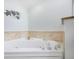 Relaxing corner jacuzzi tub with tile surround at 3311 S Atlantic Ave # 802, Daytona Beach, FL 32118
