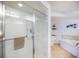 Bright bathroom featuring a walk-in shower and tile flooring at 3311 S Atlantic Ave # 802, Daytona Beach, FL 32118