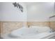 Relaxing corner jacuzzi tub with tile surround at 3311 S Atlantic Ave # 802, Daytona Beach, FL 32118