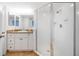 Clean bathroom with a walk-in shower and granite vanity at 3311 S Atlantic Ave # 802, Daytona Beach, FL 32118