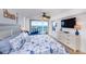 King bedroom suite with ocean view, tile floors, and coastal decor at 3311 S Atlantic Ave # 802, Daytona Beach, FL 32118