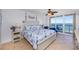 Ocean view bedroom with a king bed, tile floors, and beach-themed decor at 3311 S Atlantic Ave # 802, Daytona Beach, FL 32118