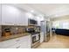 Modern kitchen with stainless steel appliances and granite countertops at 3311 S Atlantic Ave # 802, Daytona Beach, FL 32118