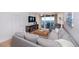 Spacious living area featuring ocean view, large TV, and comfortable sectional sofa at 3311 S Atlantic Ave # 802, Daytona Beach, FL 32118