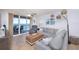 Bright living room with ocean view, comfy seating, and tiled floors at 3311 S Atlantic Ave # 802, Daytona Beach, FL 32118