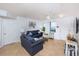 Living room with a sofa, chair, and coastal-themed decor at 3311 S Atlantic Ave # 802, Daytona Beach, FL 32118