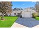 Single-story home with a two-car garage and well-maintained lawn at 3313 Celena Cir, St Cloud, FL 34769