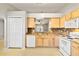 Kitchen features light wood cabinets, double sink, and built in microwave at 3313 Celena Cir, St Cloud, FL 34769
