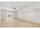 Spacious living room with carpeting and sliding glass doors at 3313 Celena Cir, St Cloud, FL 34769