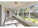 Screened porch with ceiling fans and view of yard at 3313 Celena Cir, St Cloud, FL 34769