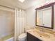 Clean bathroom with tub shower, vanity, and updated fixtures at 3606 S Peninsula Dr # 404, Port Orange, FL 32127