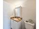 Small bathroom with single vanity and toilet at 3606 S Peninsula Dr # 404, Port Orange, FL 32127