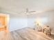 Spacious bedroom with wood-look floors and access to bathroom at 3606 S Peninsula Dr # 404, Port Orange, FL 32127
