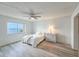 Bedroom with water views, ceiling fan, and hardwood floors at 3606 S Peninsula Dr # 404, Port Orange, FL 32127