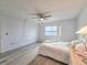 Bedroom with water views, ceiling fan and hardwood floors at 3606 S Peninsula Dr # 404, Port Orange, FL 32127