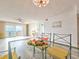 Dining room with glass table and bay view at 3606 S Peninsula Dr # 404, Port Orange, FL 32127